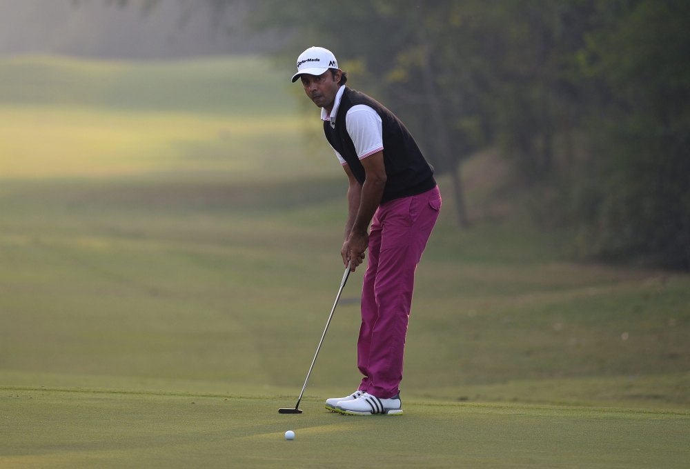 (FILES) In this file photo taken on December 4, 2016 Indian golfer Jyoti Randhawa looks on at the Panasonic Open India at the Delhi Golf Club in New Delhi. AFP / SAJJAD HUSSAIN