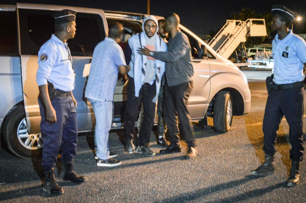  French national Peter Cherif (C) alleged associate of the Kouachi brothers, perpetrators of 2015 Charlie Hebdo attack, steps out a car as he is extradited to France at Djibouti International Airport in Djibouti on December 22, 2018. AFP / Houssein Hersi