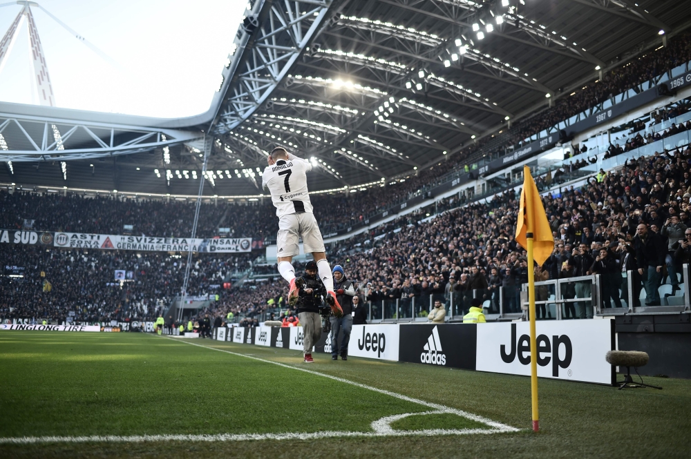 Juventus' Portuguese forward Cristiano Ronaldo celebrates after opening the scoring during the Italian Serie A football match Juventus vs Sampdoria on December 29, 2018 at the Juventus stadium in Turin. / AFP / Marco BERTORELLO