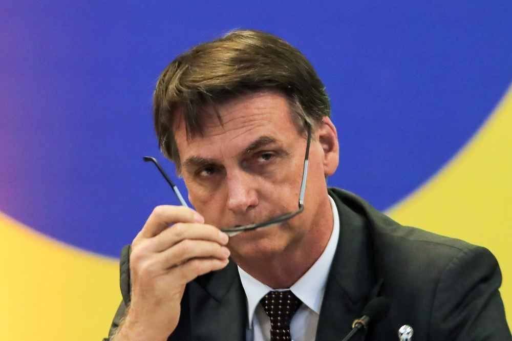 In this file photo taken on November 14, 2018 Brazil's President-elect Jair Bolsonaro, gestures during a meeting with the newly elected governors in Brasilia. (AFP / Sergio LIMA)
