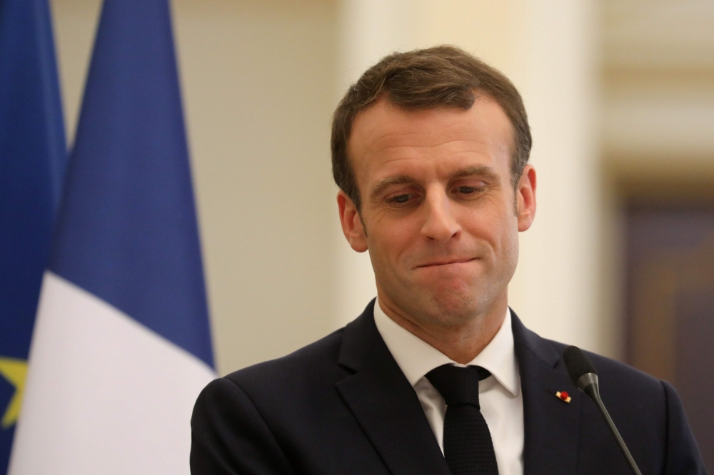 French president Emmanuel Macron looks on as he holds a press conference at the presidential palace in N'Djamena, on December 23, 2018.  AFP / Ludovic MARIN
