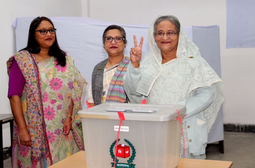Prime Minister Sheikh Hasina gestures after casting her vote in the morning during the general election in Dhaka, Bangladesh, December 30, 2018.