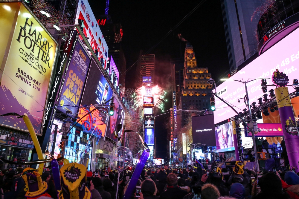 FILE PHOTO: Revelers celebrate the New Year's Eve in Times Square in Manhattan, New York, U.S., December 31, 2017. Picture taken December 31, 2017. REUTERS/Amr Alfiky