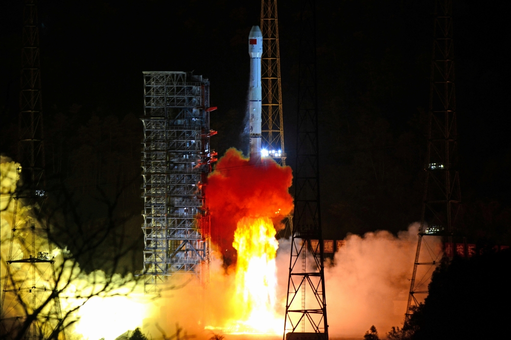 FILE PHOTO: A Long March-3B rocket carrying Chang'e 4 lunar probe takes off from the Xichang Satellite Launch Center in Sichuan province, China December 8, 2018. REUTERS/Stringer/File Photo