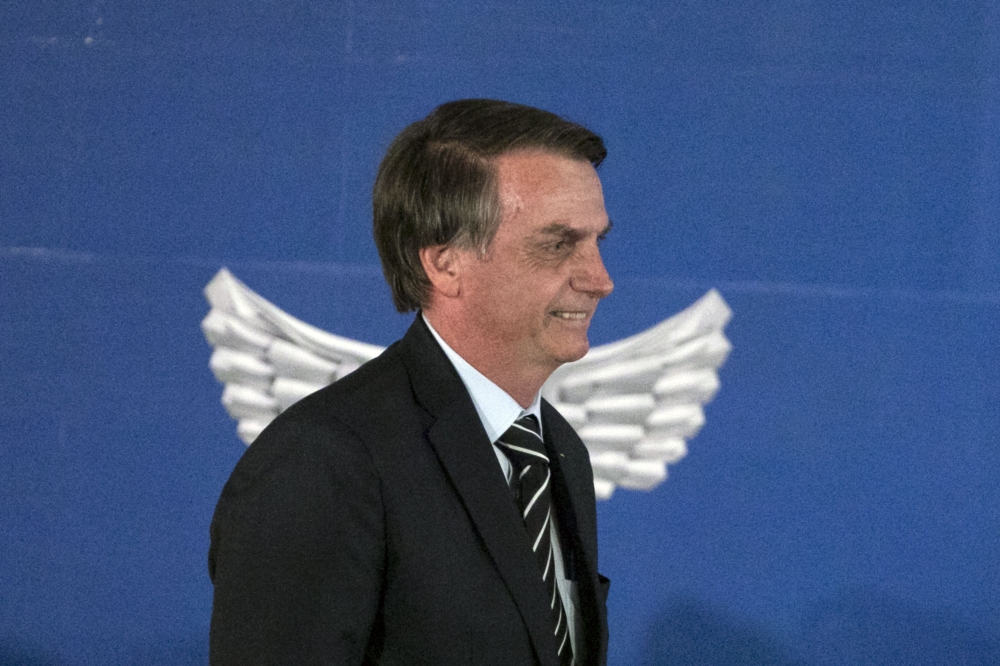 Brazil's President Jair Bolsonaro attends the handover ceremony of his new Defence Minister Fernando Azevedo e Silva in Brasilia, Brazil on January 2, 2018. (AFP / Sergio LIMA)