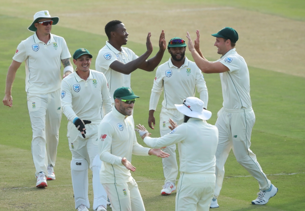 South Africa's Kagiso Rabada celebrates with team mates after taking the wicket of Pakistan's Babar Azam (REUTERS/Mike Hutchings)