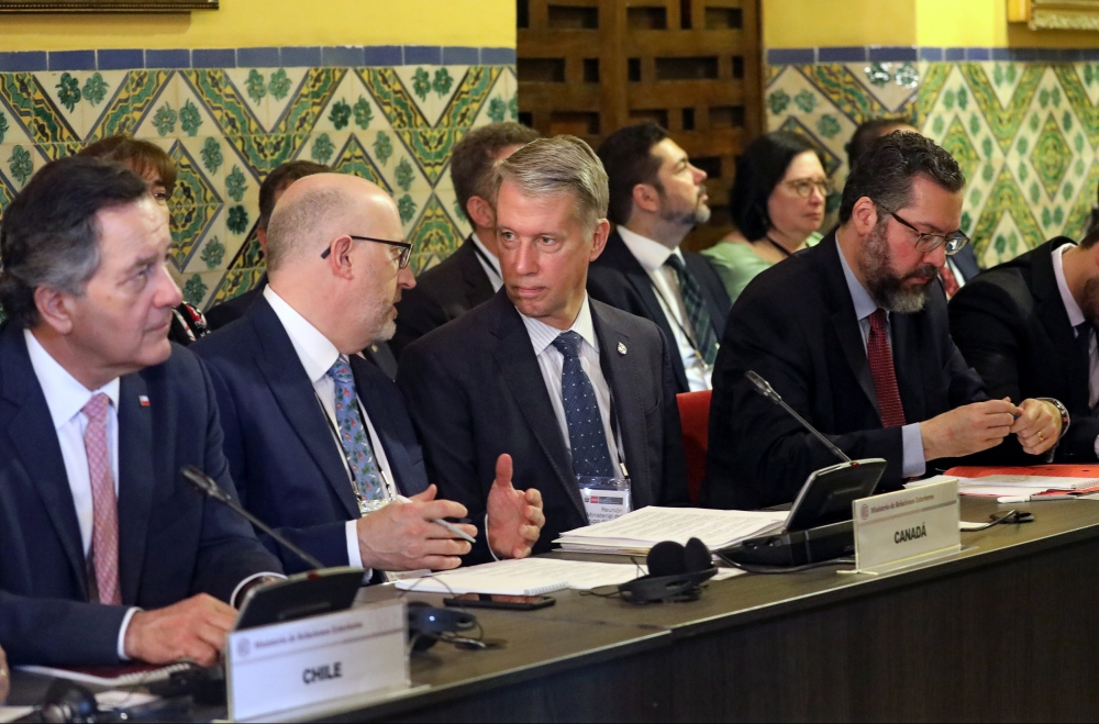 Chile's Foreign Minister Roberto Ampuero, Canada's Parliamentary Secretary to the Minister of Foreign Affairs Andrew Leslie and Brazil's Foreign Minister Ernesto Araujo attend a meeting of the Lima Group to discuss Venezuela's situation and the inaugurati