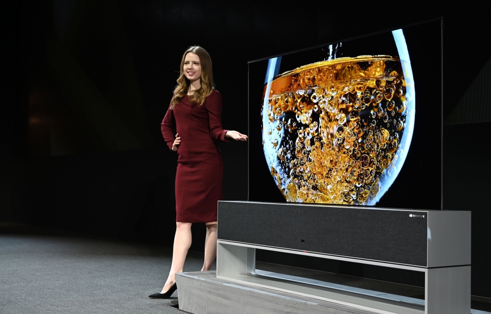 The Signature OLED TV R, a roll-up television, is presented at the LG press conference at the Mandalay Bay Convention Center during CES 2019 in Las Vegas on January 7, 2019. / AFP / Robyn Beck