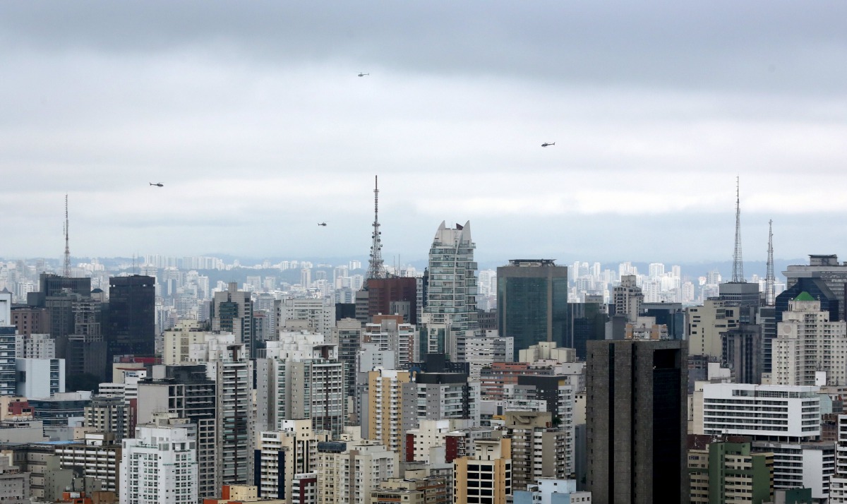 FILE PHOTO: Media helicopters fly over Paulista Avenue  in Sao Paulo, March 13, 2016. Reuters/Paulo Whitaker Whitaker