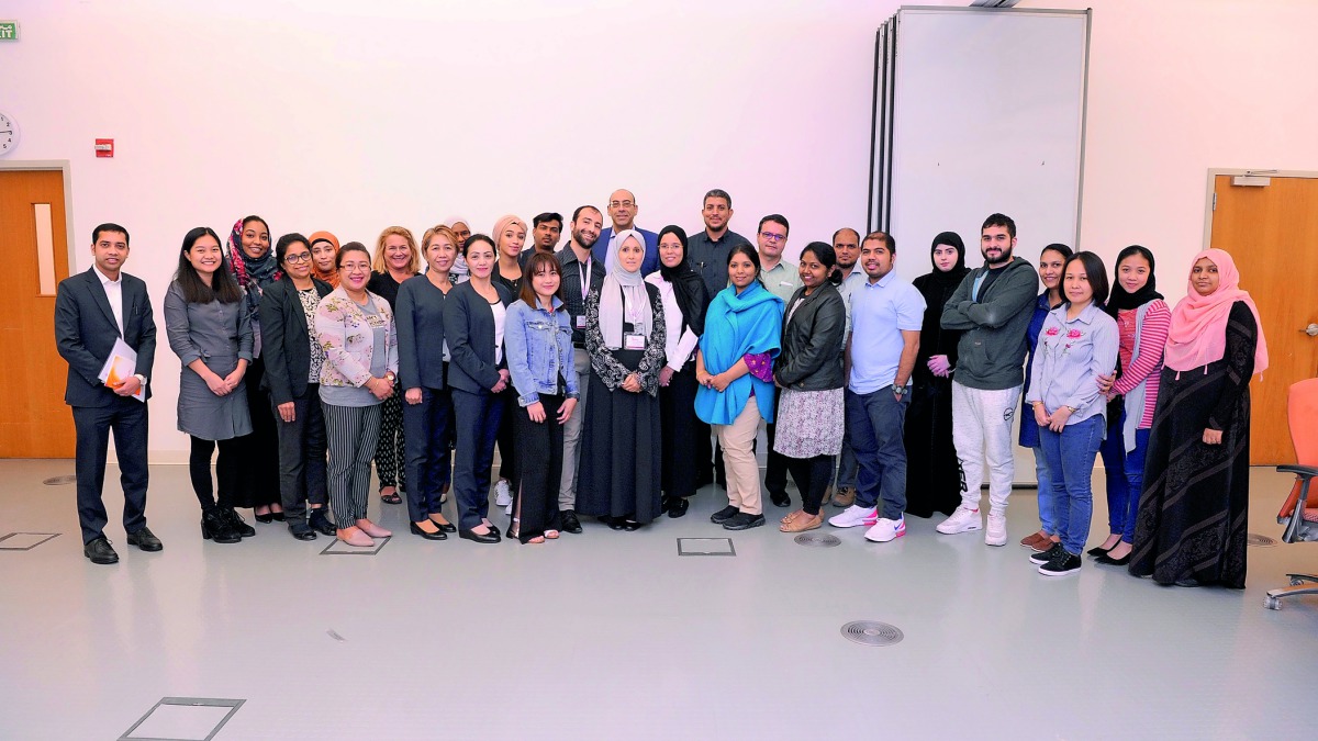The participants of WCM-Q symposium pose for a group photo. 