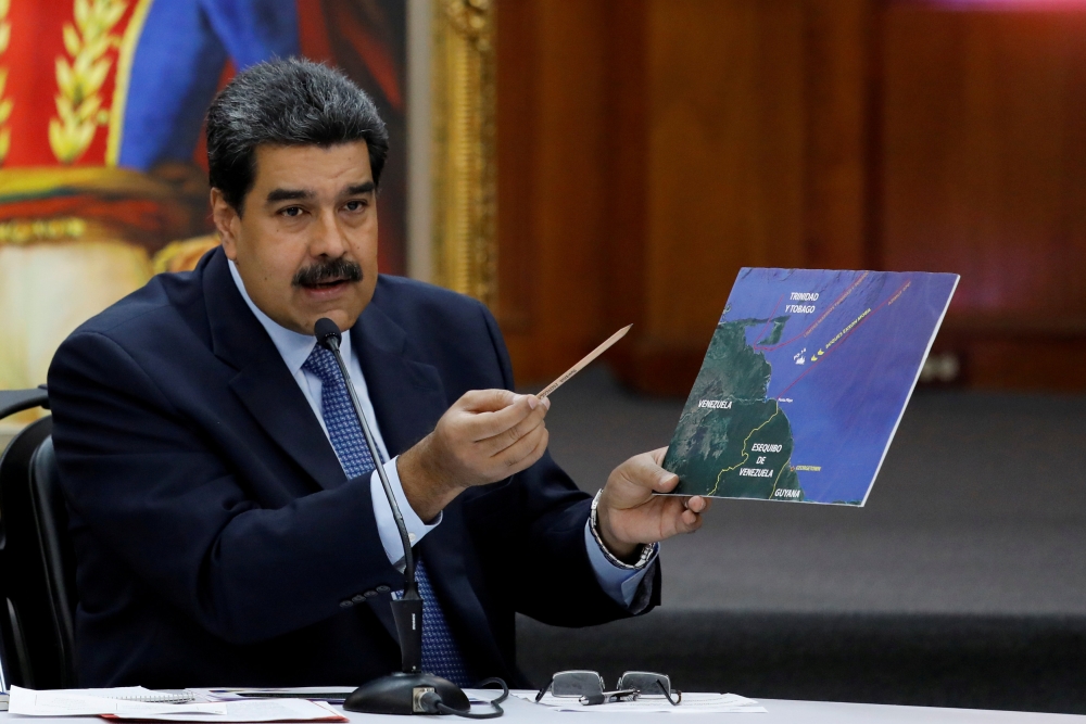 FILE PHOTO: Venezuela's President Nicolas Maduro shows a map while he speaks during a news conference at Miraflores Palace in Caracas, Venezuela, Jan. 9, 2019. REUTERS/Manaure Quintero