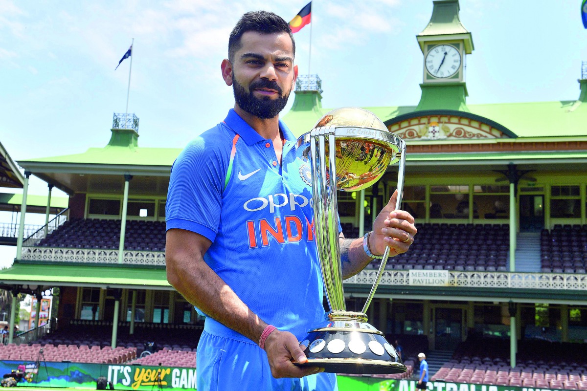  India's cricket team captain Virat Kohli poses with the ICC Cricket World Cup trophy at the Sydney Cricket Ground in Sydney on January 11, 2019. AFP / Saeed Khan
