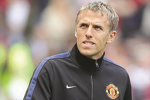 Former England and Manchester United star Phil Neville, coach of the women’s team.