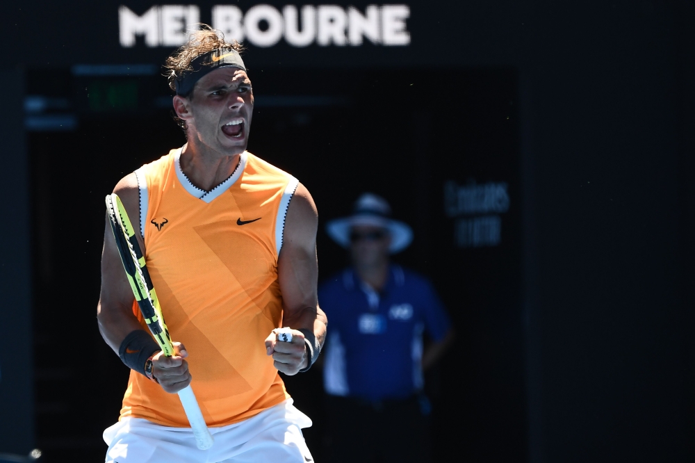 Spain's Rafael Nadal celebrates his victory against Australia's James Duckworth during their men's singles match on day one of the Australian Open tennis tournament in Melbourne on January 14, 2019. AFP / Jewel Samad 