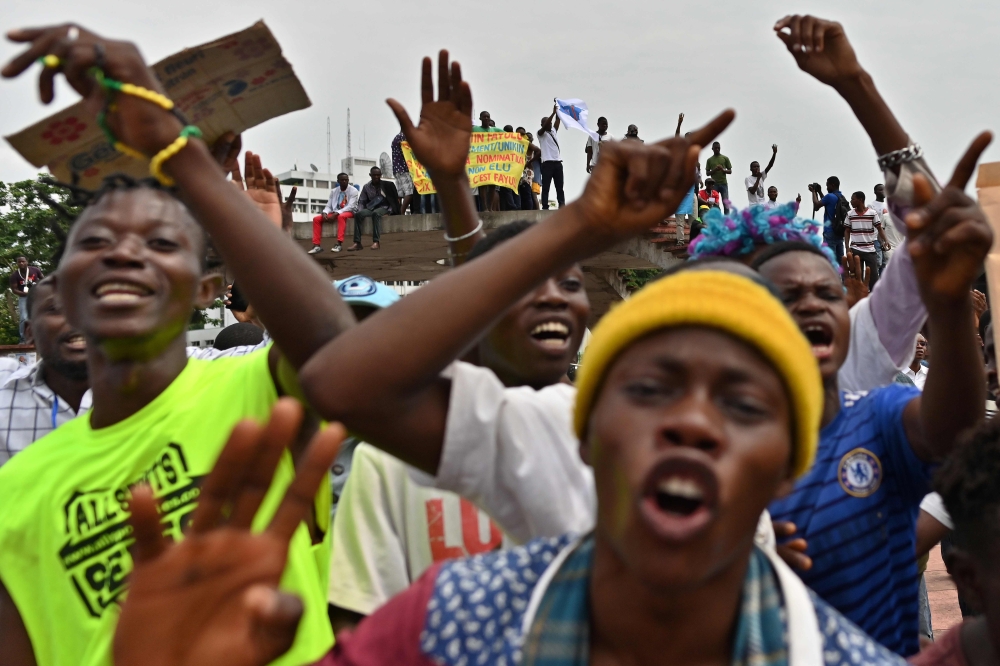 Supporters of opposition presidential candidate in the Democratic Republic of Congo Martin Fayulu sing in Kinshasa on January 12, 2019, as presidential candidate Martin Fayulu filed his appeal to impose a recount of the votes in the presidential election 