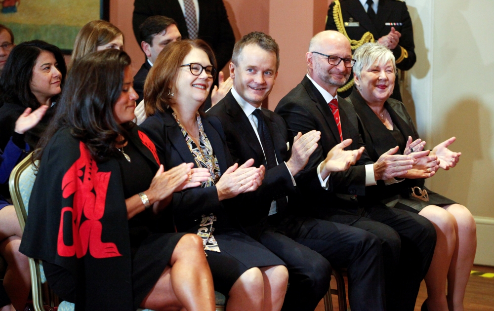 Newly appointed Veterans Affairs Minister Jody Wilson-Raybould, president of the Treasury Board Jane Philpott, Indigenous Services Minister Seamus O'Regan, Justice Minister David Lametti, and Rural Economic Development Minister Bernadette Jordan applaud a