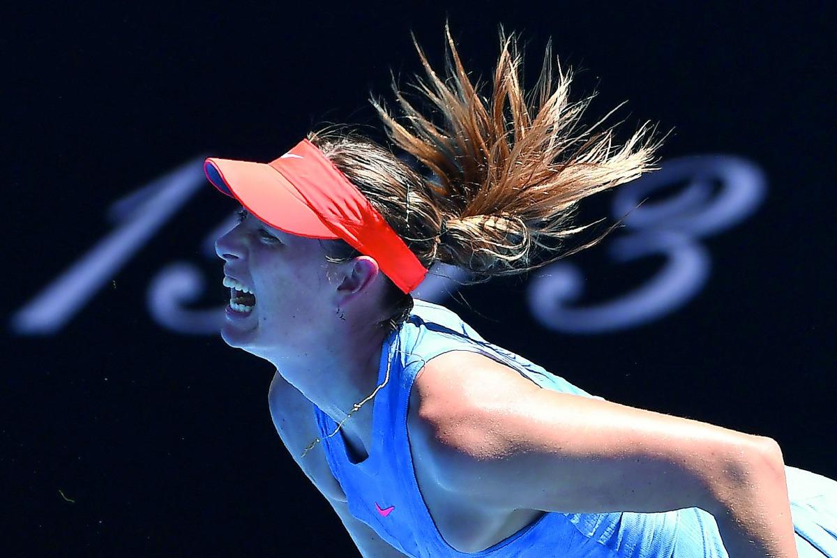 Russia's Maria Sharapova hits a return against Britain's Harriet Dart during their women's singles match on day one of the Australian Open tennis tournament in Melbourne on January 14, 2019. AFP / William West
