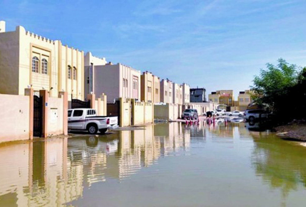 The streets surrounding houses filled with stagnant water in Umm Al Amad. Photo Credit: Al Sharq