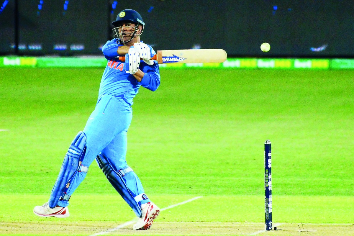 Indian batsman Mahendra Singh Dhoni hits the ball during the second one-day international match against Australia at the Adelaide Oval on Tuesday.