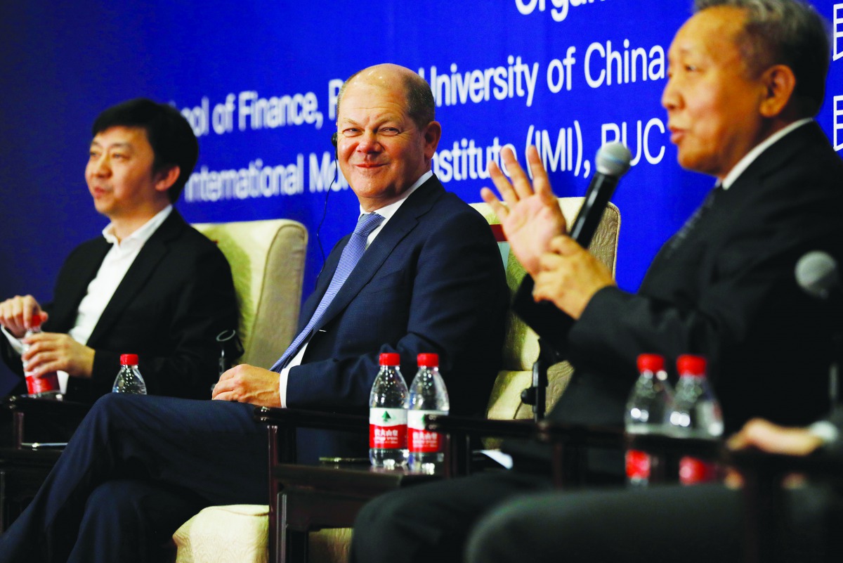 German Minister of Finance Olaf Scholz (C) listens during a roundtable with the theme 'International seminar on digital economy and social development' at Renmin University in Beijing, China, 17 January 2019. Wu Hong/Pool via Reuters