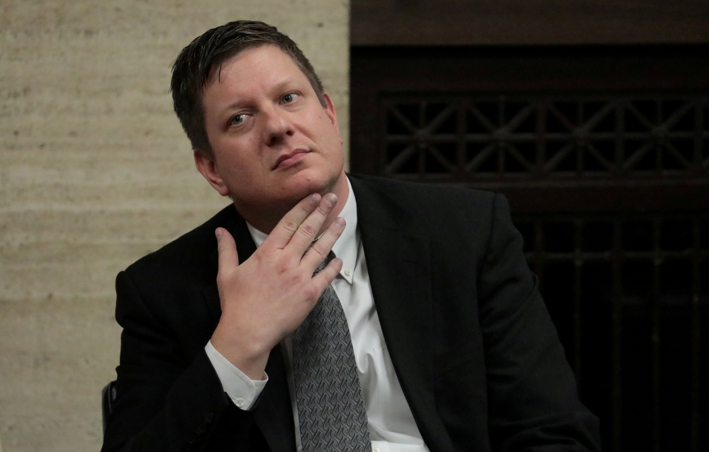 Chicago police officer Jason Van Dyke looks as the murder trial of 17-year old Laquan McDonald going on in Chicago, October 5, 2018/ Antonio Perez/Chicago Tribune/Reuters