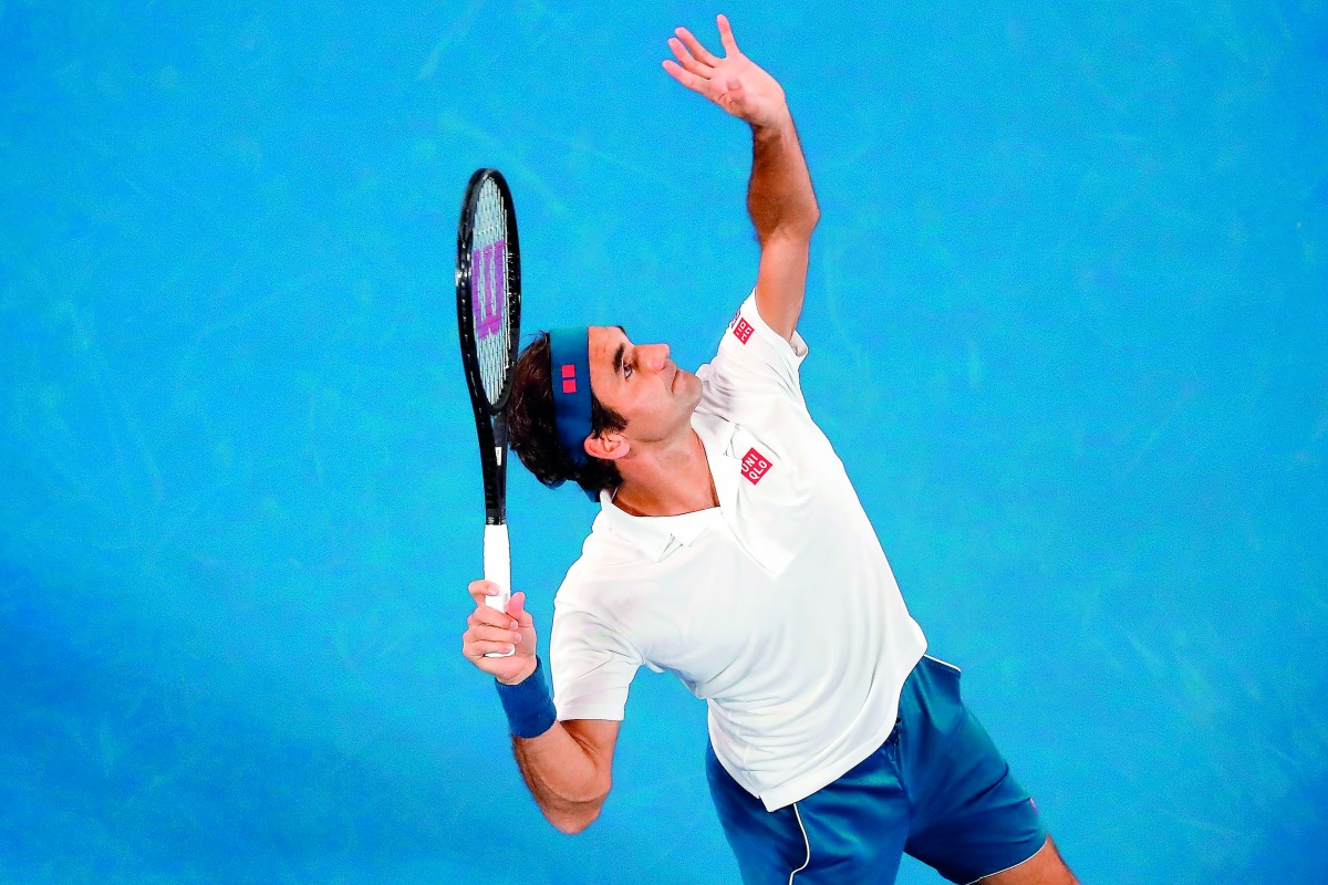 Switzerland's Roger Federer serves against Taylor Fritz of the US during their men's singles match on day five of the Australian Open tennis tournament in Melbourne on January 18, 2019. AFP / David Gray