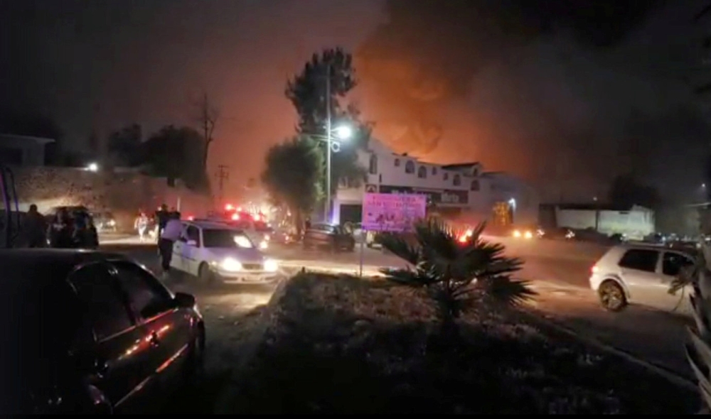 People react at the scene where a ruptured fuel pipeline exploded, in the municipality of Tlahuelilpan, Hidalgo, Mexico, near the Tula refinery of state oil firm Petroleos Mexicanos (Pemex), January 18, 2019 in this still image taken from a video obtained