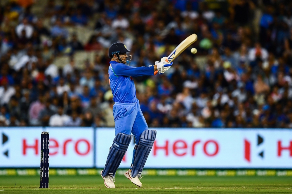 India's Mahendra Singh Dhoni plays a shot during the third one-day international cricket match between Australia and India at the Melbourne Cricket Ground in Melbourne on January 18, 2019. (AFP / Jewel SAMAD)