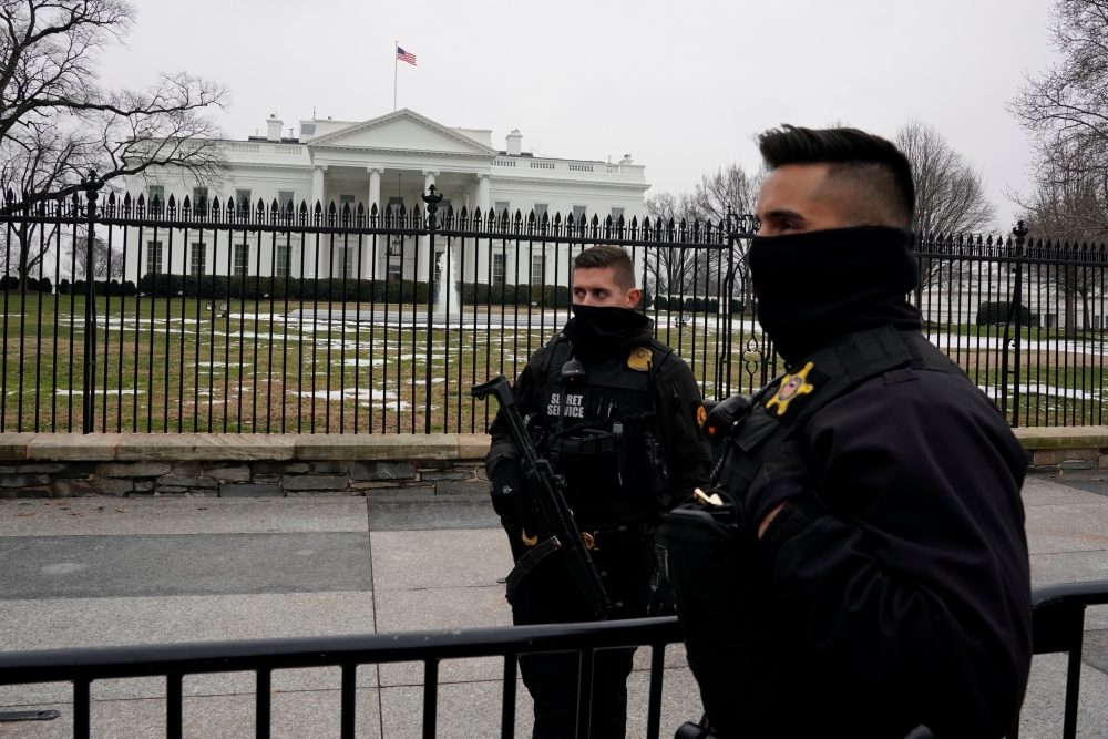 U.S. Secret Service Uniformed Division officers stand in front of White House as they continue to work without pay due to the government shutdown, in Washington, U.S., January 19, 2019. REUTERS/Yuri Gripas