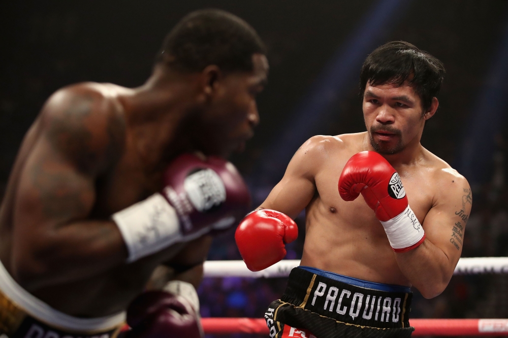 Manny Pacquiao (R) squares up with Adrien Broner during the WBA welterweight championship at MGM Grand Garden Arena on January 19, 2019, in Las Vegas, Nevada. Christian Petersen/Getty Images/AFP 