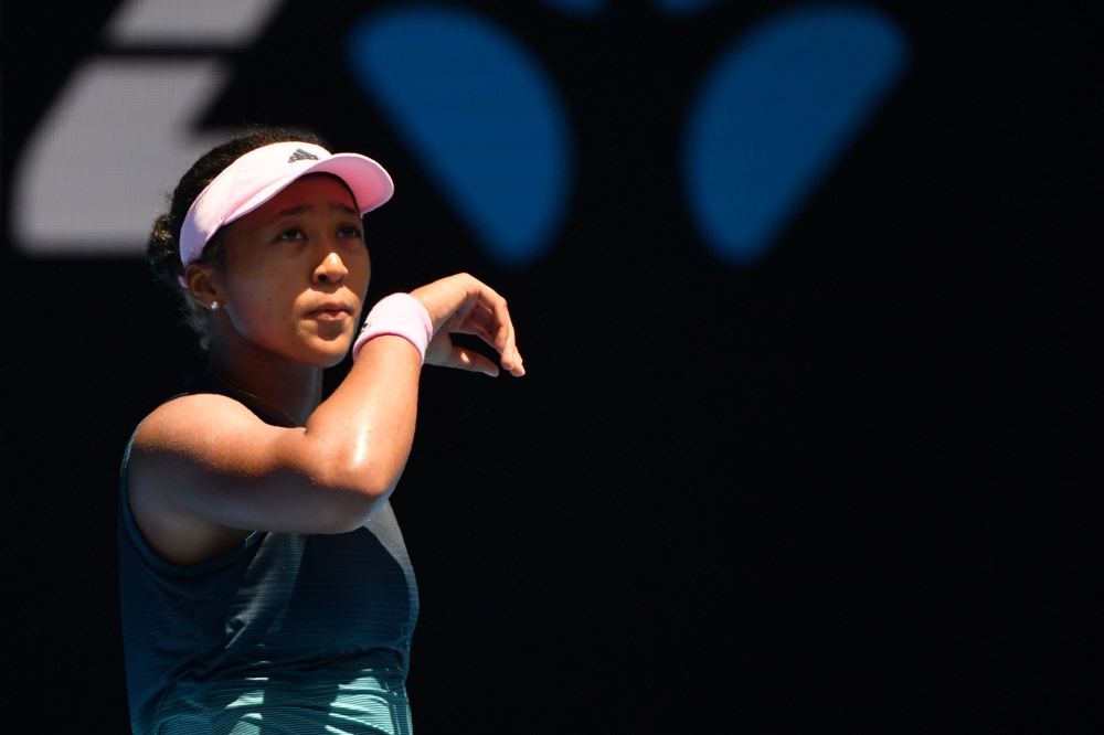 Japan's Naomi Osaka reacts after a point against Latvia's Anastasija Sevastova during their women's singles match on day eight of the Australian Open tennis tournament in Melbourne on January 21, 2019. AFP / Peter Parks 