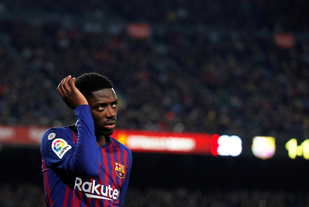 Barcelona's Ousmane Dembele leaves the pitch after sustaining an injury REUTERS/Albert Gea 