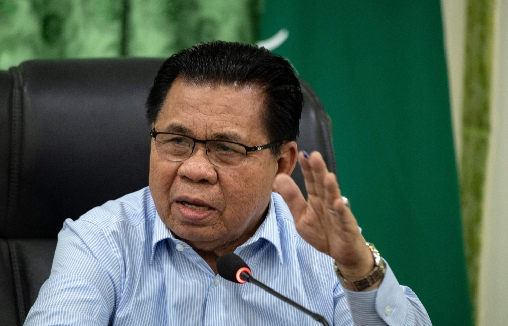 Moro Islamic Liberation Front (MILF) chairman Murad Ebrahim gestures during a press conference at the MILF's Camp Darapanan in Sultan Kudarat, Maguindanaoo on the southern Philippine island of Mindanao on January 21, 2019, as a vote takes place on giving 