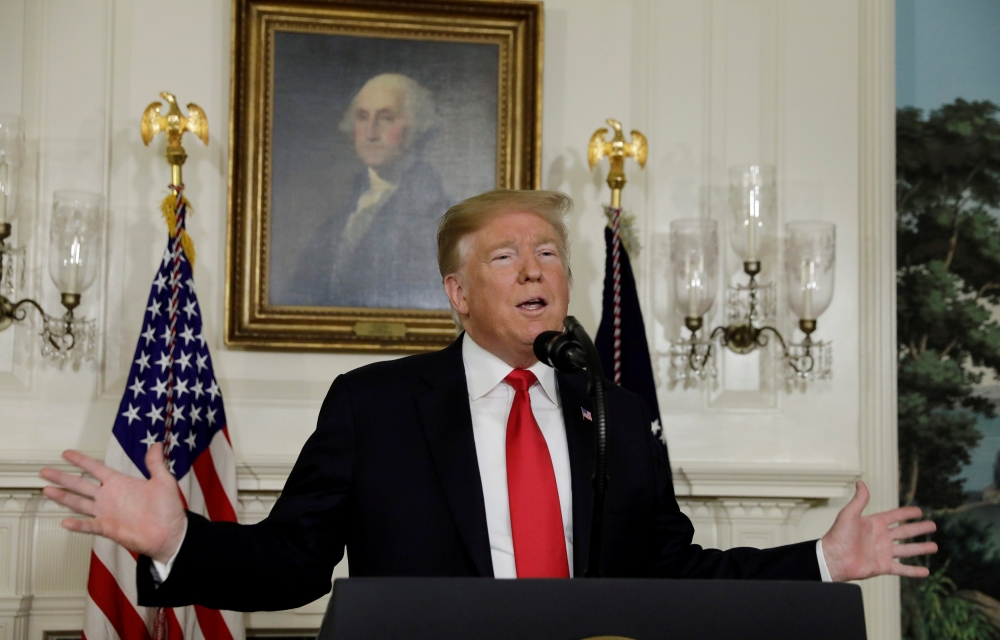 FILE PHOTO: US President Donald Trump delivers remarks on border security and the partial shutdown of the US government from the Diplomatic Room at the White House in Washington, US, Jan. 19, 2019. REUTERS/Yuri Gripas/File Photo
