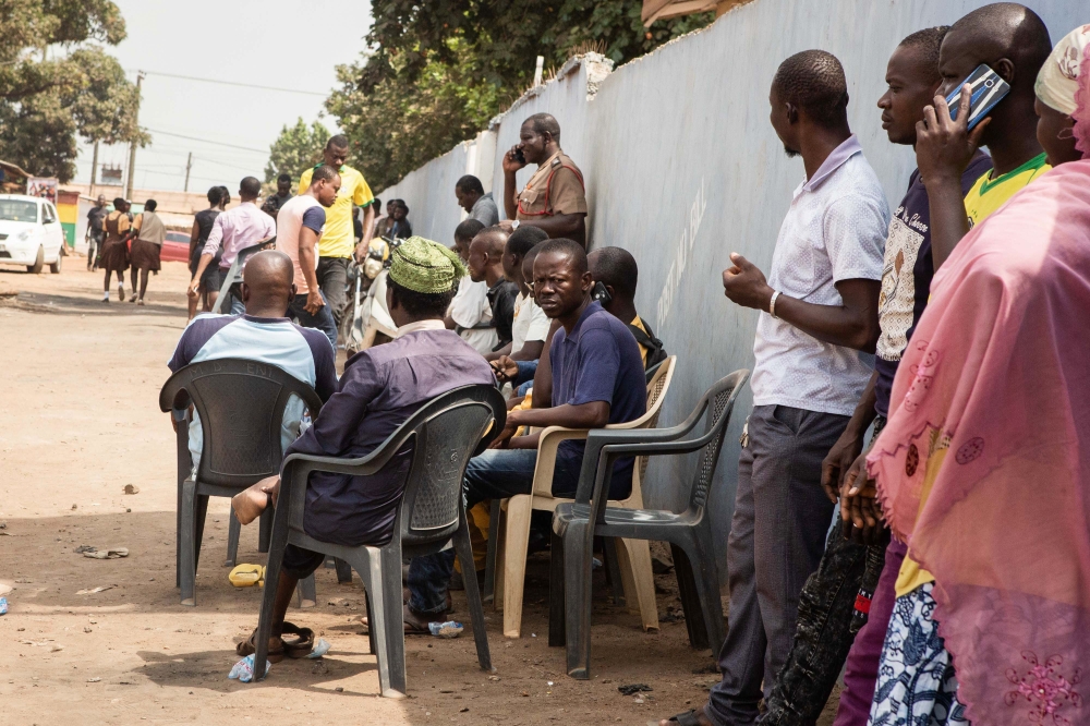 Family and friends gather to discuss the murder of Ghanian undercover reporter Ahmed Hussein Suale at a popular spot where he used to sit and drink with family and friends in Accra, on January 17, 2019. / AFP / RUTH MCDOWALL 