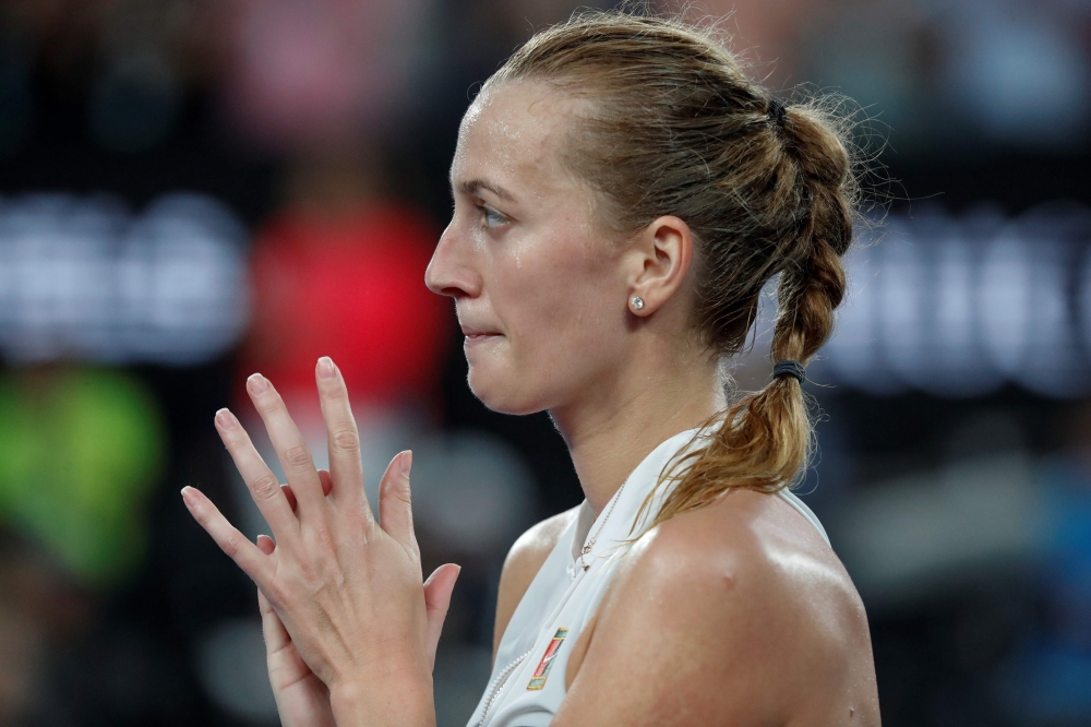 Czech Republic's Petra Kvitova applauds and reacts after winning the women's singles quarter-final match against Australia's Ashleigh Barty on day nine of the Australian Open tennis tournament in Melbourne on January 22, 2019. AFP / DAVID GRAY 