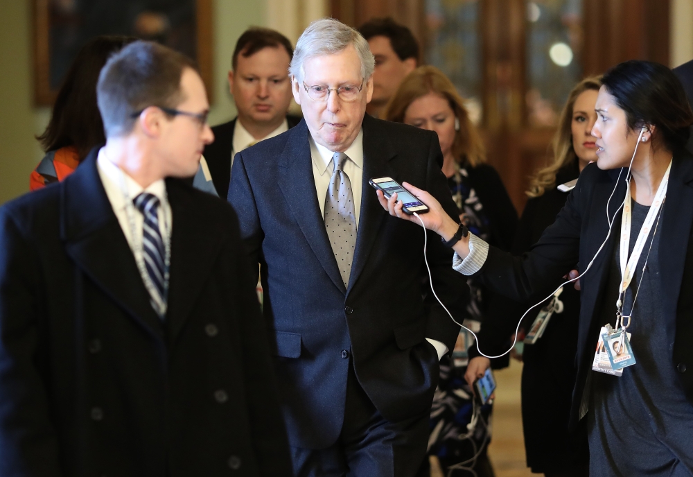 Senate Majority Leader Mitch McConnell (R_KY is trailed by reporters after speaking on the floor of the U.S. Senate on January 22, 2019 in Washington, DC. Win McNamee/Getty Images/AFP 