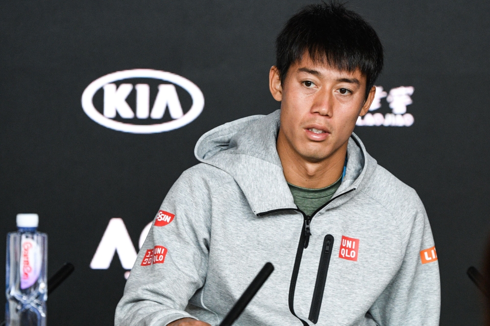Japan's Kei Nishikori attends a press conference after retiring from his men's singles quarter-final match against Serbia's Novak Djokovic on day ten of the Australian Open tennis tournament in Melbourne on January 23, 2019. AFP / SAEED KHAN /