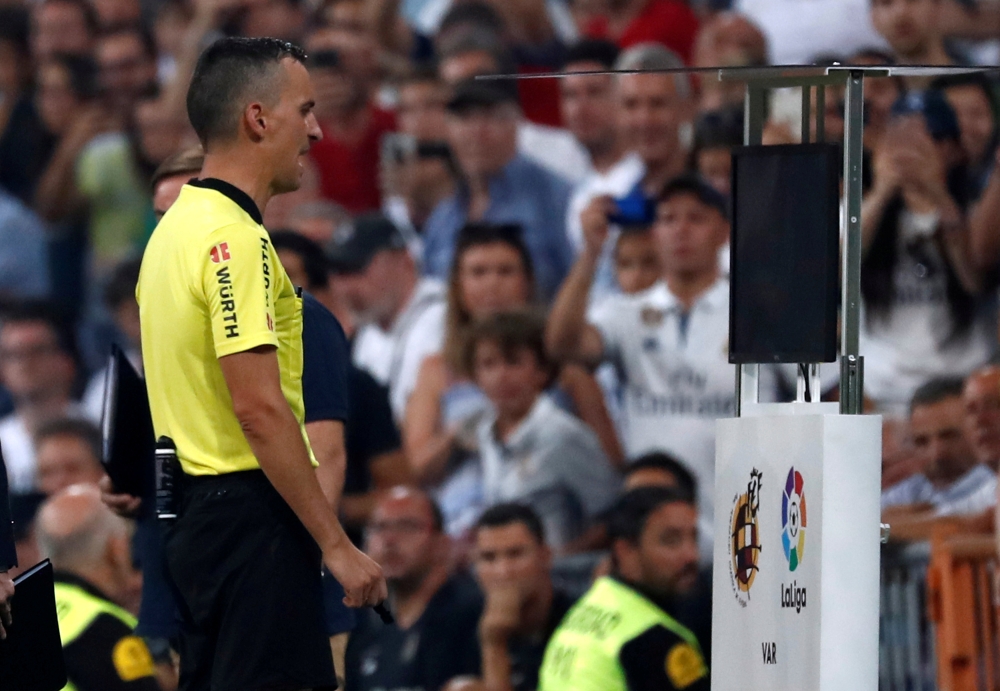La Liga Referee checks VAR at Santiago Bernabeu, Madrid, Spain - September 1, 2018. Reuters/Javier Barbancho