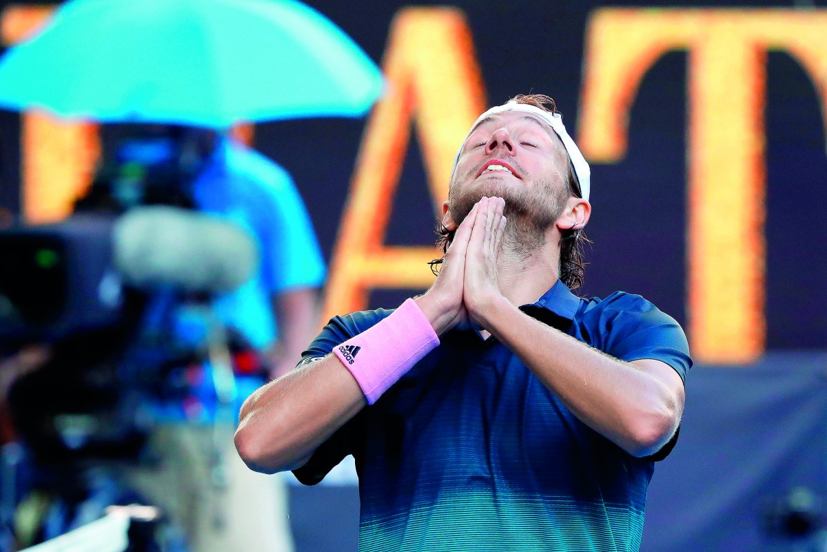 France's Lucas Pouille celebrates his victory against Canada's Milos Raonic during their men's singles quarter-final match on day ten of the Australian Open tennis tournament in Melbourne on January 23, 2019. AFP / David Gray