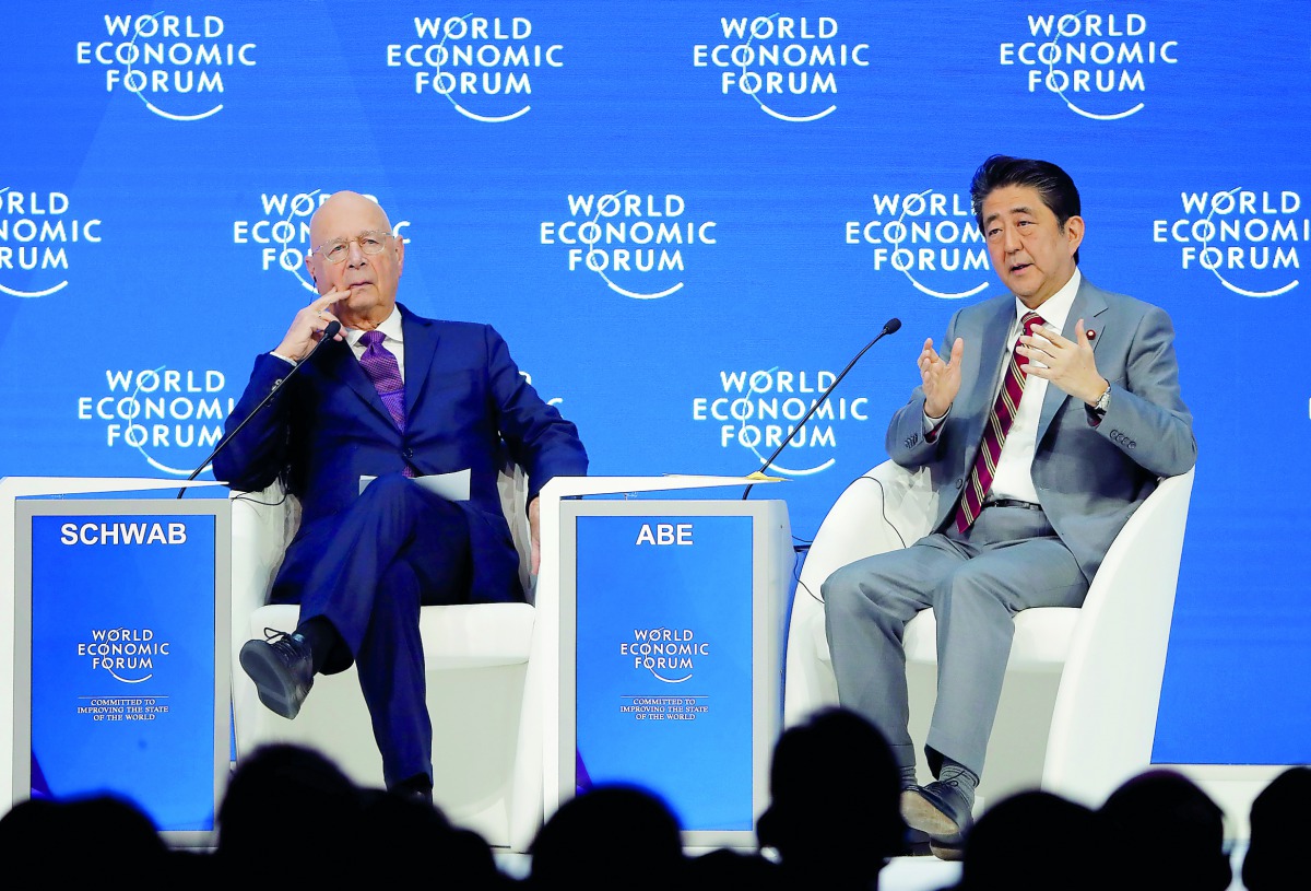 Japanese Prime Minister Shinzo Abe and Executive Chairman of the WEF Klaus Schwab attend the World Economic Forum (WEF) annual meeting in Davos, Switzerland, January 23, 2019. Reuters/Arnd Wiegmann