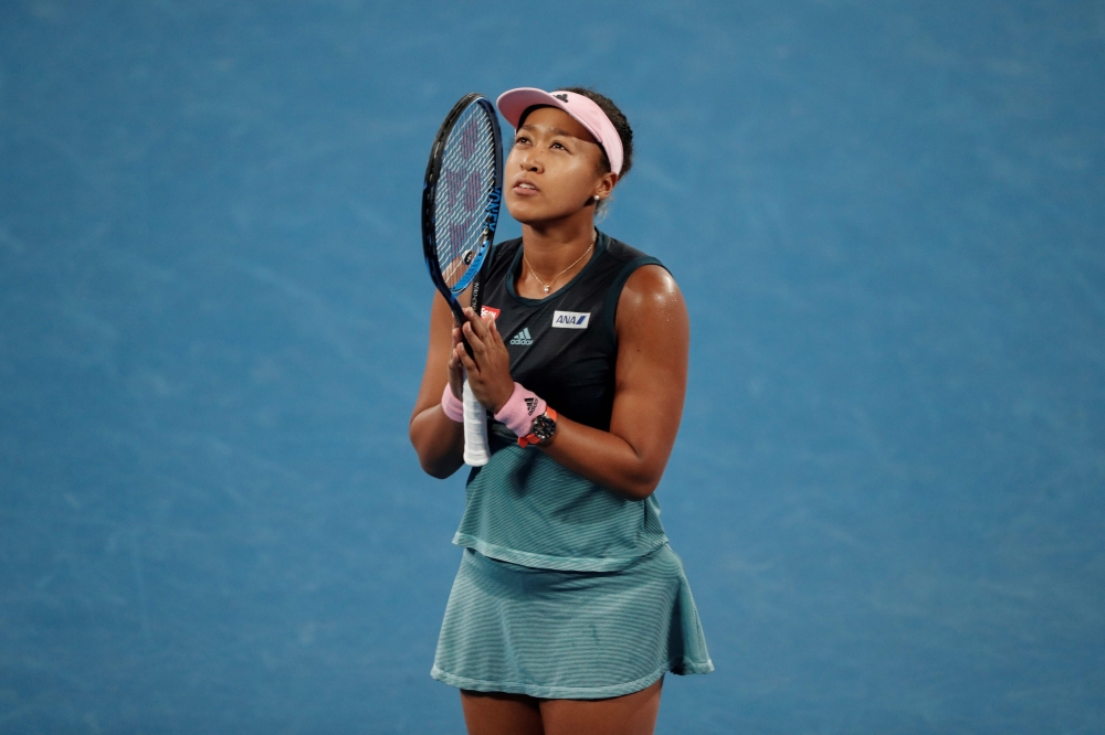 Japan's Naomi Osaka celebrates after victory over Czech Republic's Karolina Pliskova during their women's singles semi-final match on day 11 of the Australian Open tennis tournament in Melbourne on January 24, 2019. AFP / DAVID GRAY 
