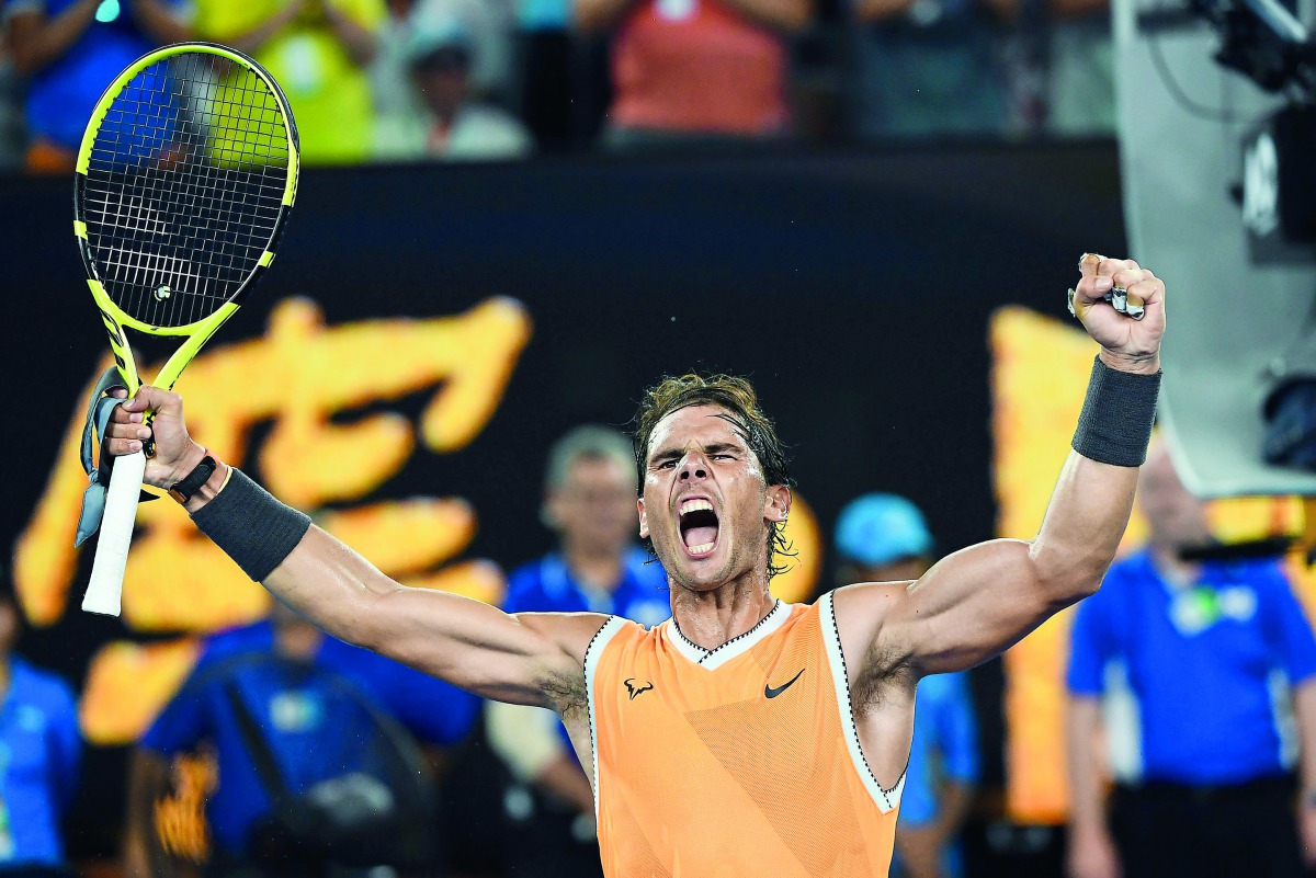 Spain's Rafael Nadal celebrates his victory against Greece's Stefanos Tsitsipas during their men's singles semi-final match on day 11 of the Australian Open tennis tournament in Melbourne on January 24, 2019. AFP / William West