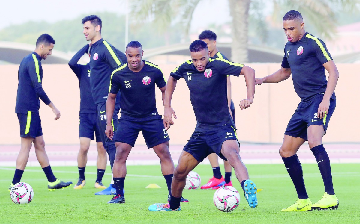 Qatari players take part in a practice session ahead of their AFC Asian Cup Quarter-final match against South Korea which will be played in Abu Dhabi, today.