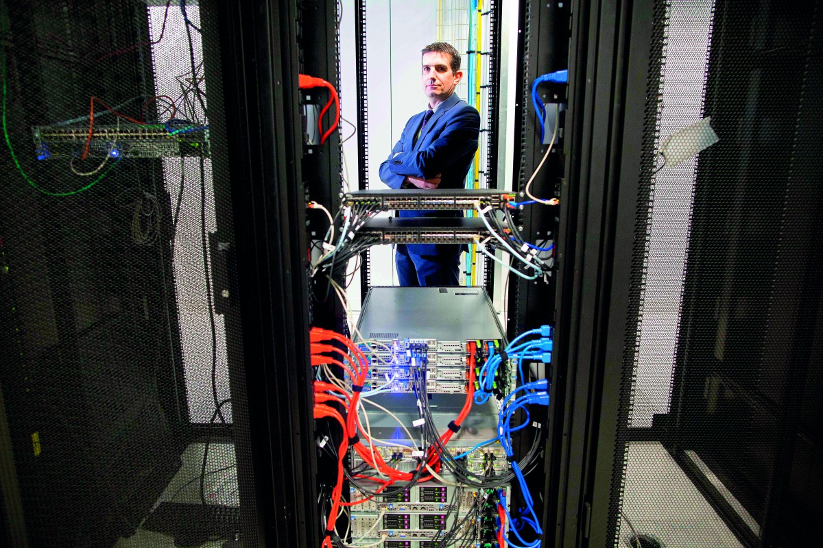 Commercial Director, Brian Roe poses for a photograph beside the cabinets inside Servecentric Data Centre on the outskirts of Dublin in Ireland on December 10, 2018. AFP / Paul Faith