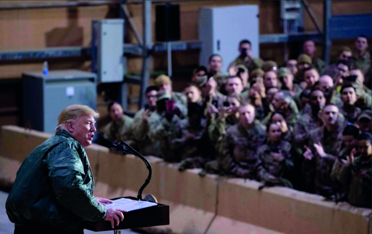 US President Donald Trump speaks at a hangar rally at Al Asad Air Base, Iraq on December 26, 2018