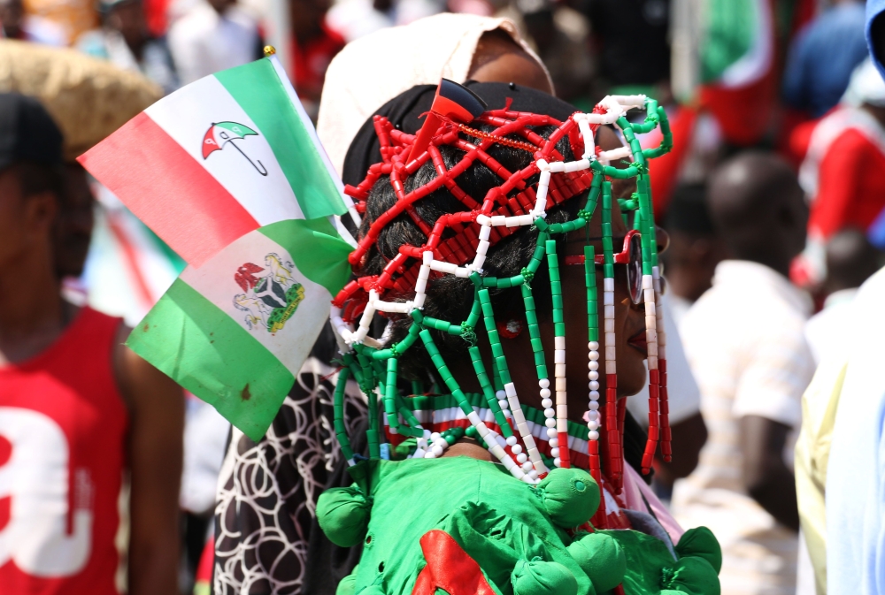 A woman wears People's Democratic Party (PDP) apparel during a campaign rally of Nigerian PDP opposition presidential candidate Atiku Abubakar at the Ahmadu Bello Stadium in Kaduna on January 24, 2019, ahead of Nigeria's general elections of February 16. 
