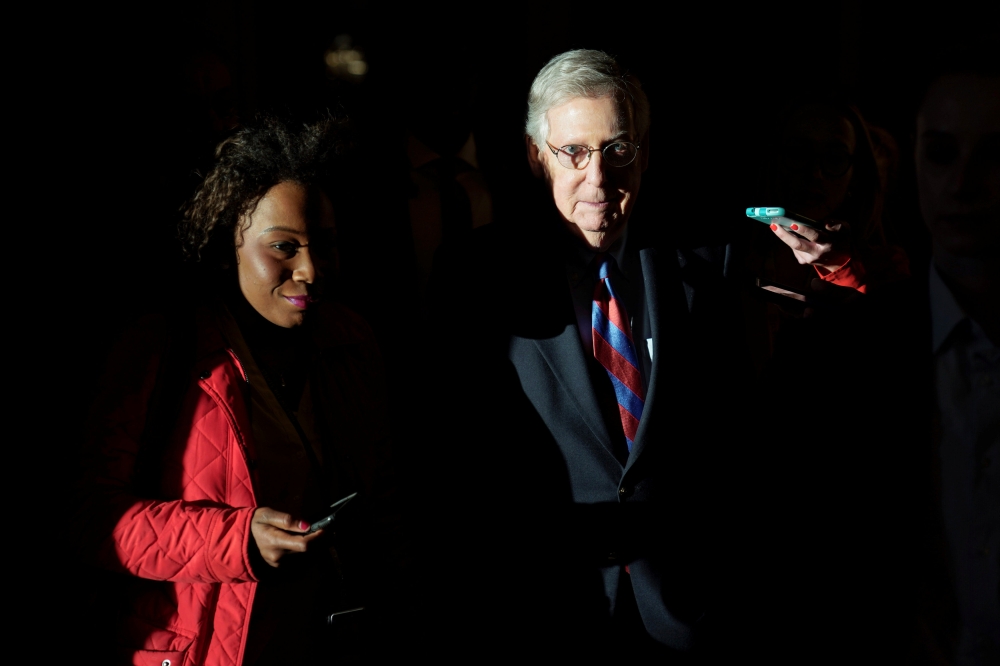 Senate Majority Leader Mitch McConnell (R-KY) is followed by reporters after the Senate passed legislation to end the partial government shutdown on Capitol Hill in Washington, U.S., January 25, 2019. Reuters/Joshua Roberts
