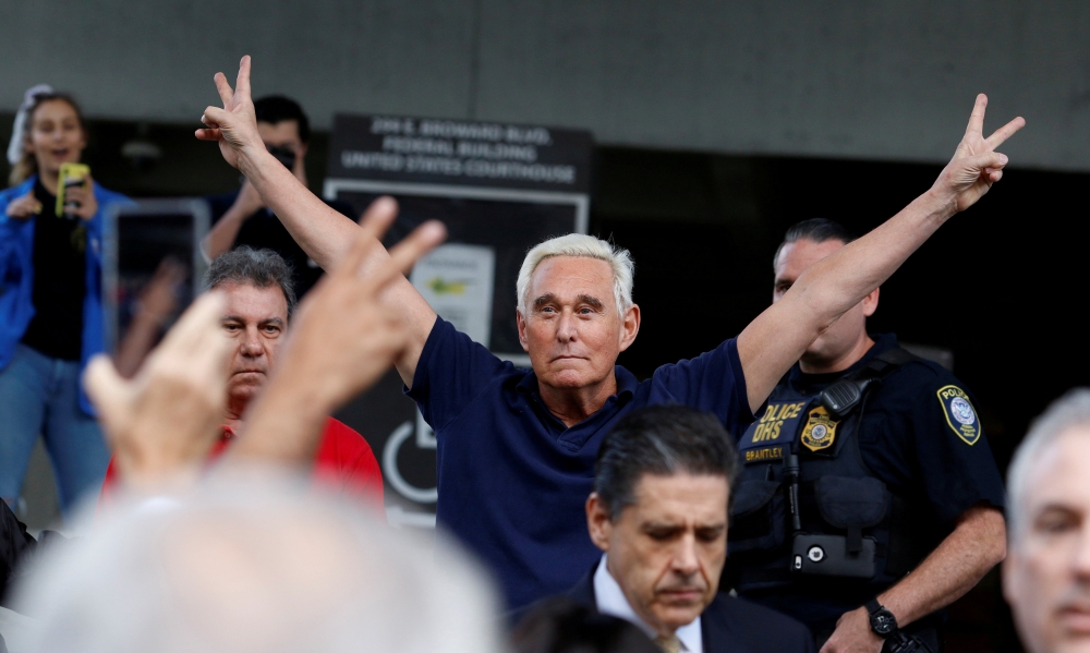 Roger Stone reacts as he walks to microphones after his appearance at Federal Court in Fort Lauderdale, Florida, U.S., January 25, 2019. REUTERS/Joe Skipper TPX IMAGES OF THE DAY