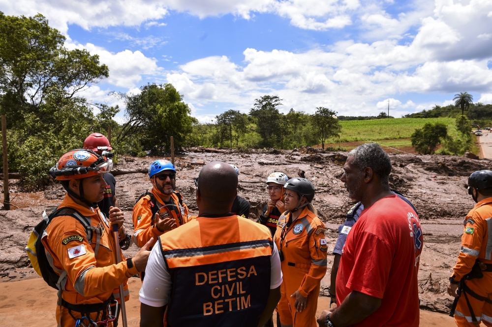 Rescue workers are seen at the scene after a tailings dam collapsed at an iron ore mine in Brumadinho, state of Minas Gerias, in southeastern Brazil, on January 26, 2019. (Lucas Bois - Anadolu Agency)